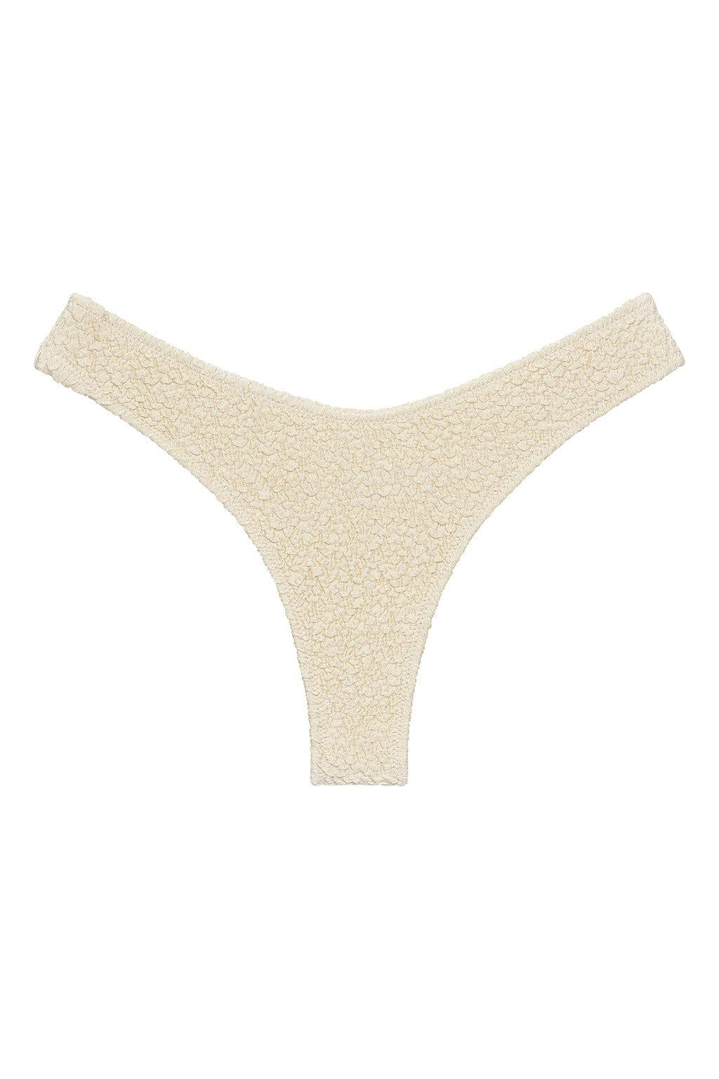 Oat-colored bikini bottom with textured fabric and zig-zag stitching on wide side straps.
