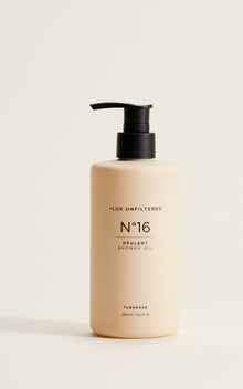 Front view of LUX Unfiltered N°16 Opulent Shower Oil pump bottle showing beige bottle, black pump, and 'Tuberose' scent label on a neutral background