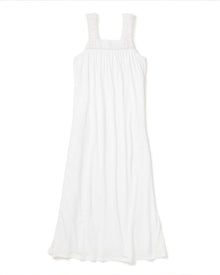The Womens Pima Camille Nightgown in White by Petite Plume offers wide straps and a gathered bodice. Crafted from lightweight Peruvian Pima cotton, it flows elegantly on a plain white backdrop, exuding simplicity and charm.