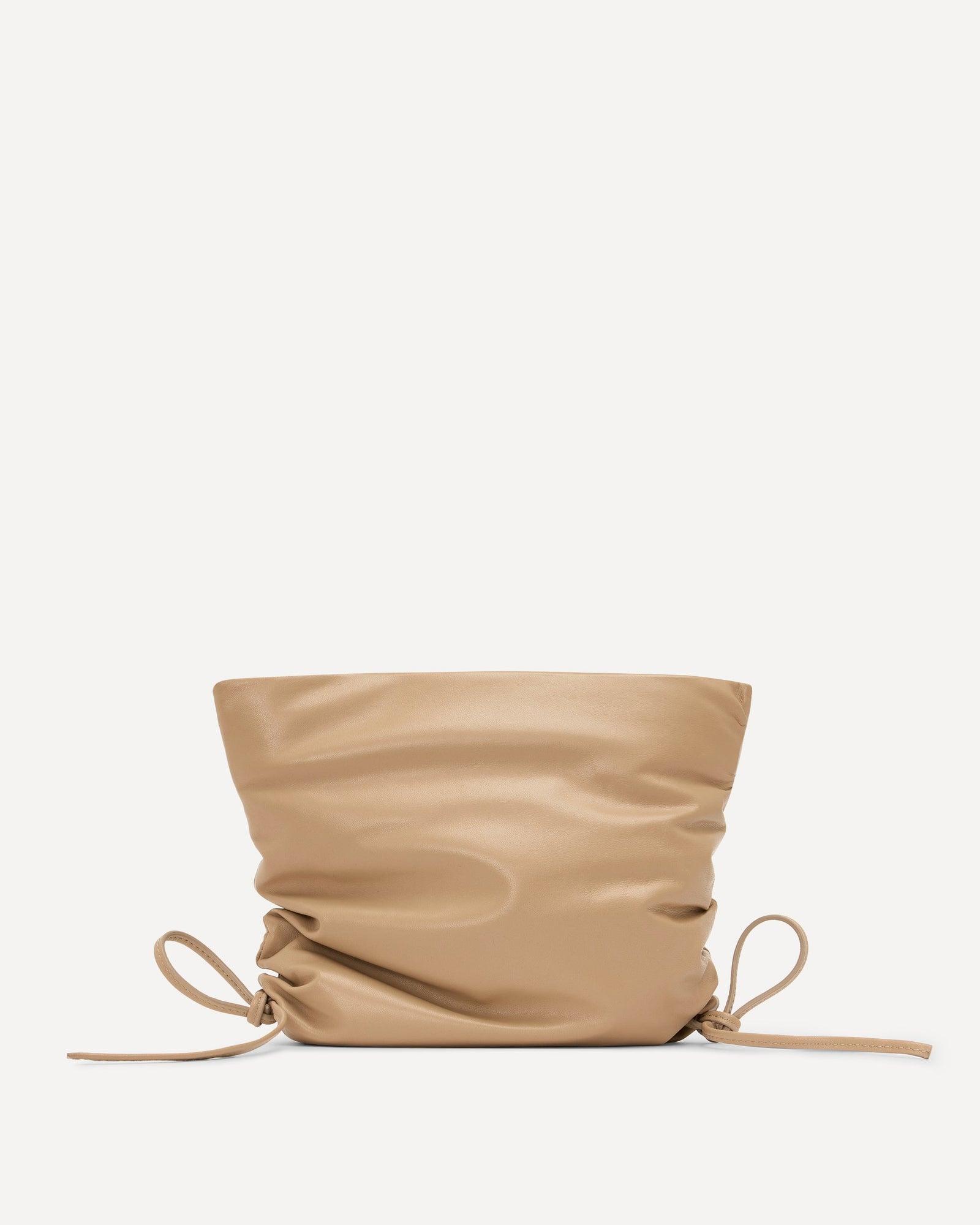 Beige drawstring bag on a light beige background