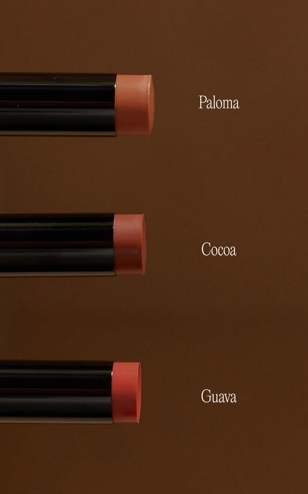Three lip crayon tips on brown background labeled Paloma, Cocoa, Guava
