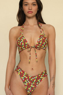 Bikini bottom with red, yellow, and white floral print in high-cut style.