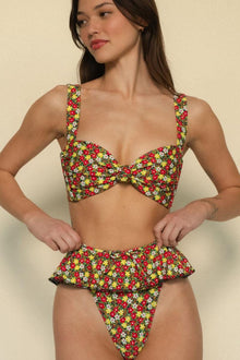 Bikini bottom with red, yellow, and white floral print featuring layered ruffles at the sides.