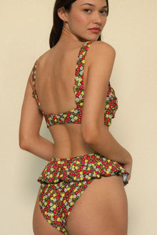 Red, yellow, and white floral bikini bottom with layered ruffle detail on back.