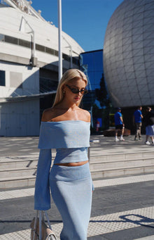 Beginning Boutique Simona Blue Long Sleeve Off Shoulder Knit Top shimmery light blue off-shoulder knit top with long flared s