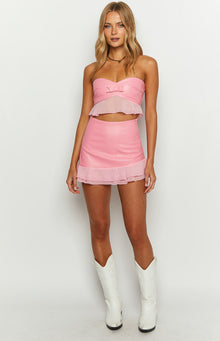 Pink fitted mini skirt with a smooth main body and a sheer ruffled organza hem