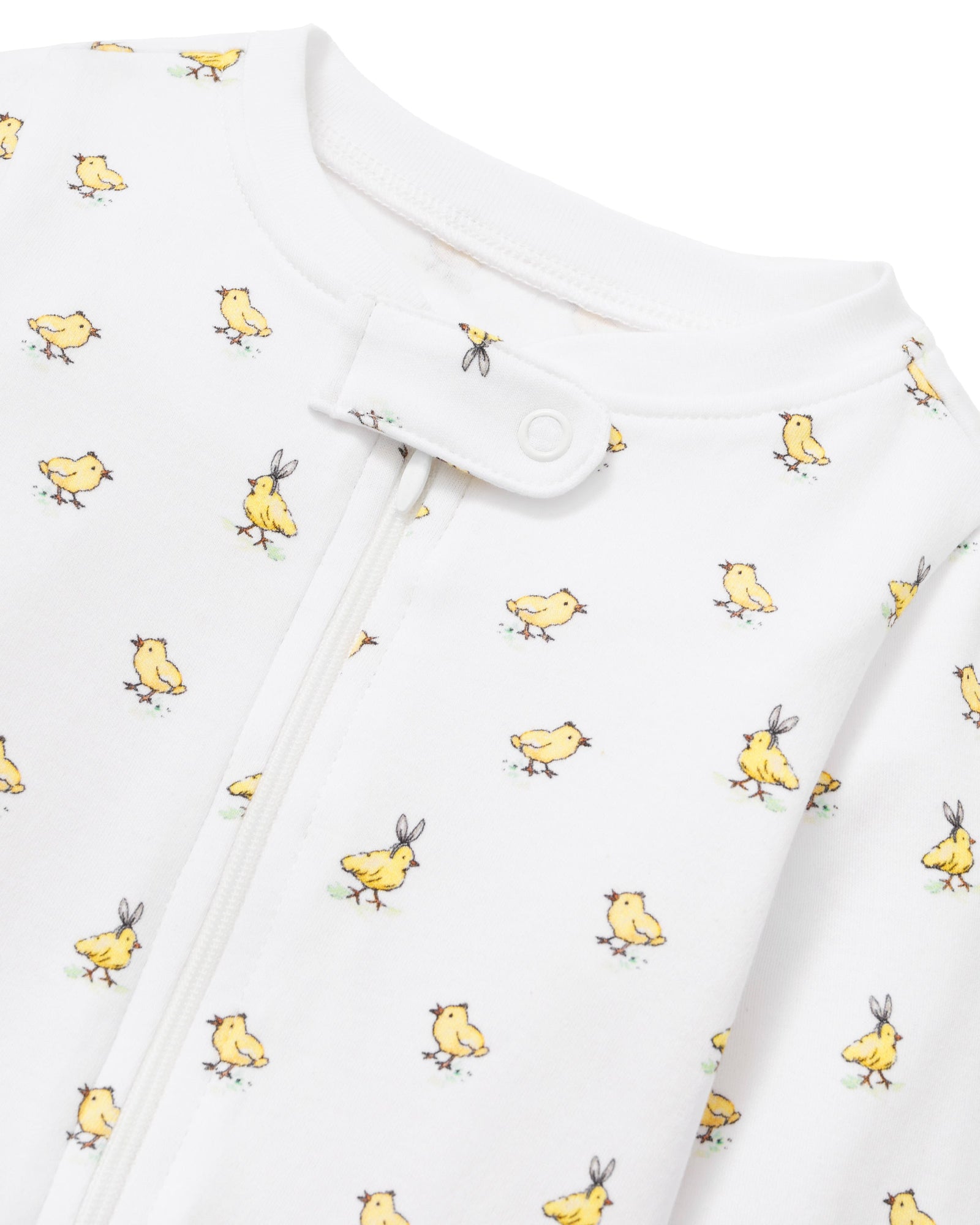 The Baby's Pima Romper in Tres Chick is a white, long-sleeve onesie with a yellow duckling print, footed bottoms, folded cuffs, and a zipper running from the collar to one leg.
