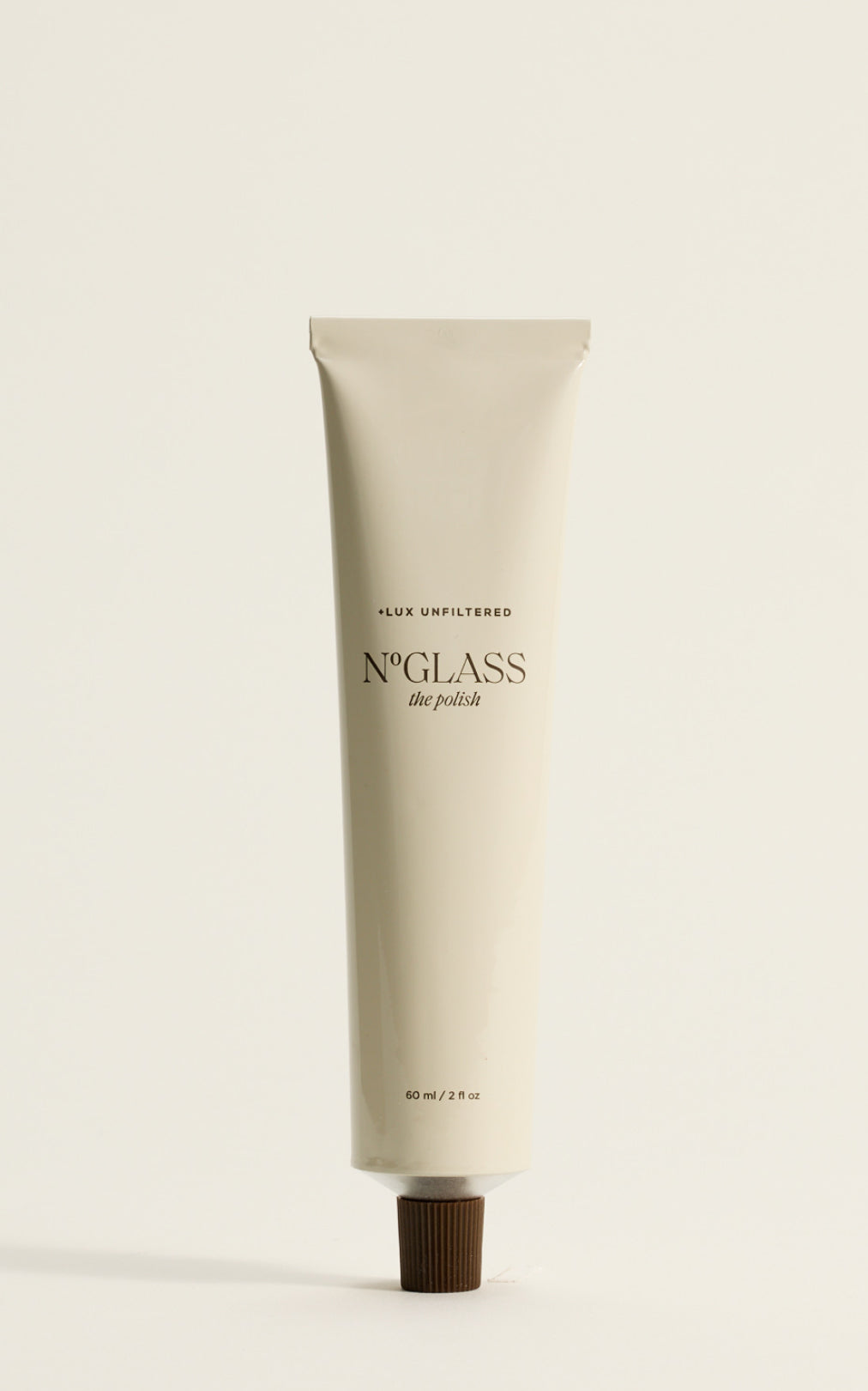 Tube of N°GLASS the polish labeled '+LUX UNFILTERED' and '60 ml / 2 fl oz'.