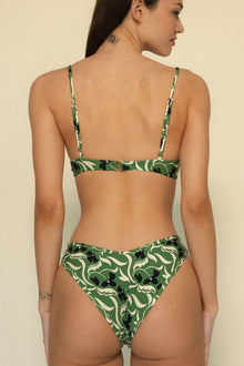 Green and cream floral bikini bottom with black leaf accents and adjustable side ties.