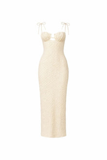 Cream textured long slip dress with sweetheart neckline, cutout detail, and adjustable tie shoulder straps.
