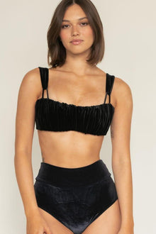 Black velvet high-rise bikini bottom with wide waistband worn on model.