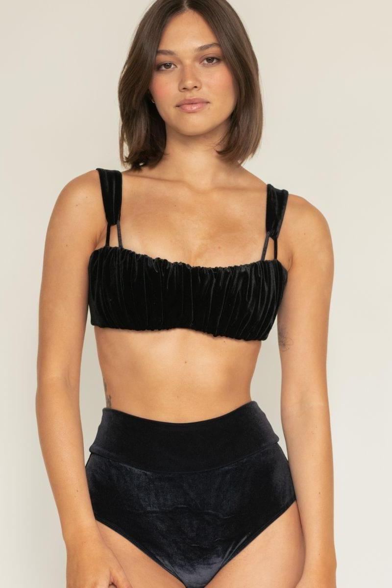 Black velvet high-rise bikini bottom with wide waistband worn on model.