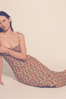 Long slip dress with multicolored floral print, thin shoulder straps, and sweetheart neckline.