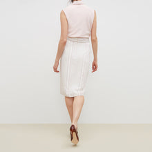 Back image of a woman standing wearing the lenox skirt in twill stripe in ivory / red