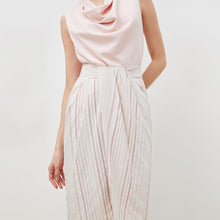 Detail image of a woman standing wearing the lenox skirt in twill stripe in ivory / red