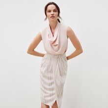 Front image of a woman standing wearing the lenox skirt in twill stripe in ivory / red