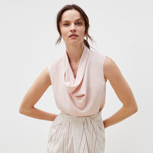 Front image of a woman standing wearing the lenox skirt in twill stripe in ivory / red | Exclude