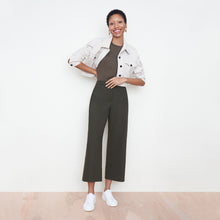 Front image of a woman standing wearing the avery top in safari | Exclude