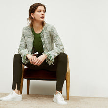 Front image of a woman standing wearing the curie pant in dark olive | Exclude