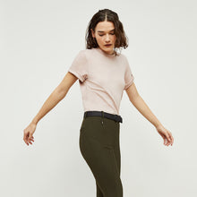 Side image of a woman standing wearing the curie pant in dark olive | Exclude