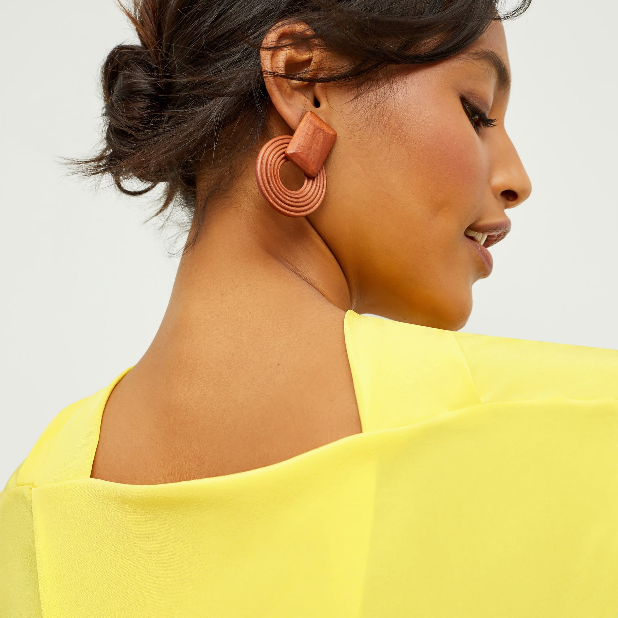 Detail image of a woman standing wearing the Daisy Top—Washable Silk in Sunshine