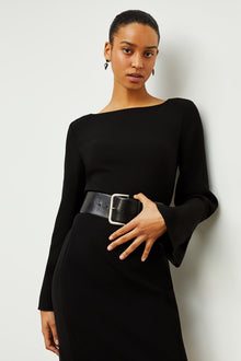 Front image of a woman standing wearing the Regina Dress in Black | Grid Hover | Exclude