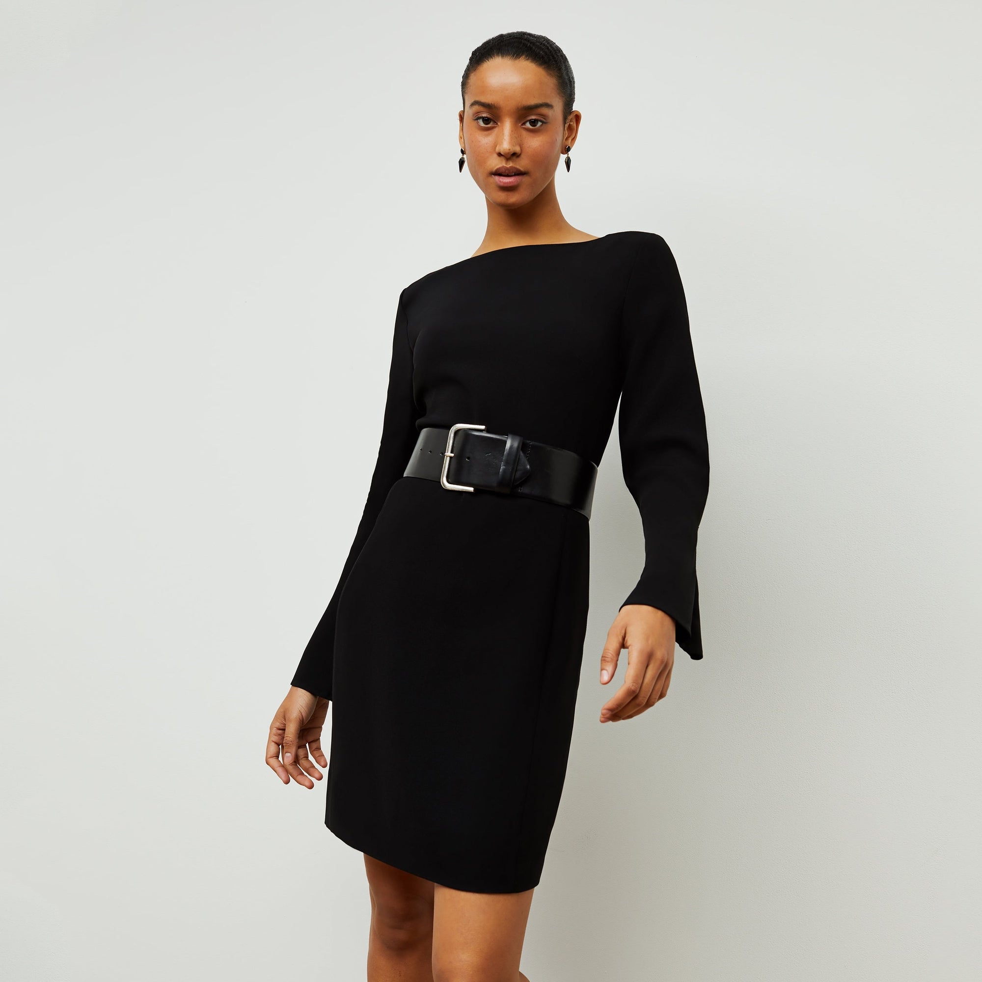 Front image of a woman standing wearing the Regina Dress in Black| Exclude