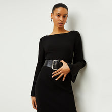 Front image of a woman standing wearing the Regina Dress in Black