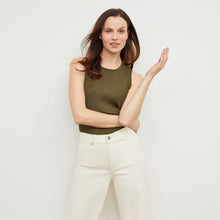 Front image of a woman standing wearing the avery top in safari