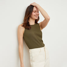 Side image of a woman standing wearing the avery top in safari