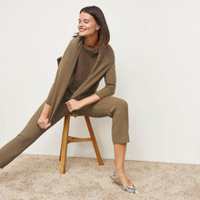 Front image of a woman standing wearing the Finley Legging—Ribbed Jardigan Knit in Light Bronze
