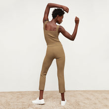 Back image of a woman standing wearing the Finley Legging—Ribbed Jardigan Knit in Light Bronze