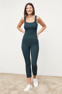Front image of a woman standing wearing the Finley Legging—Ribbed Jardigan Knit in Deep Sea | Grid Hover | Exclude