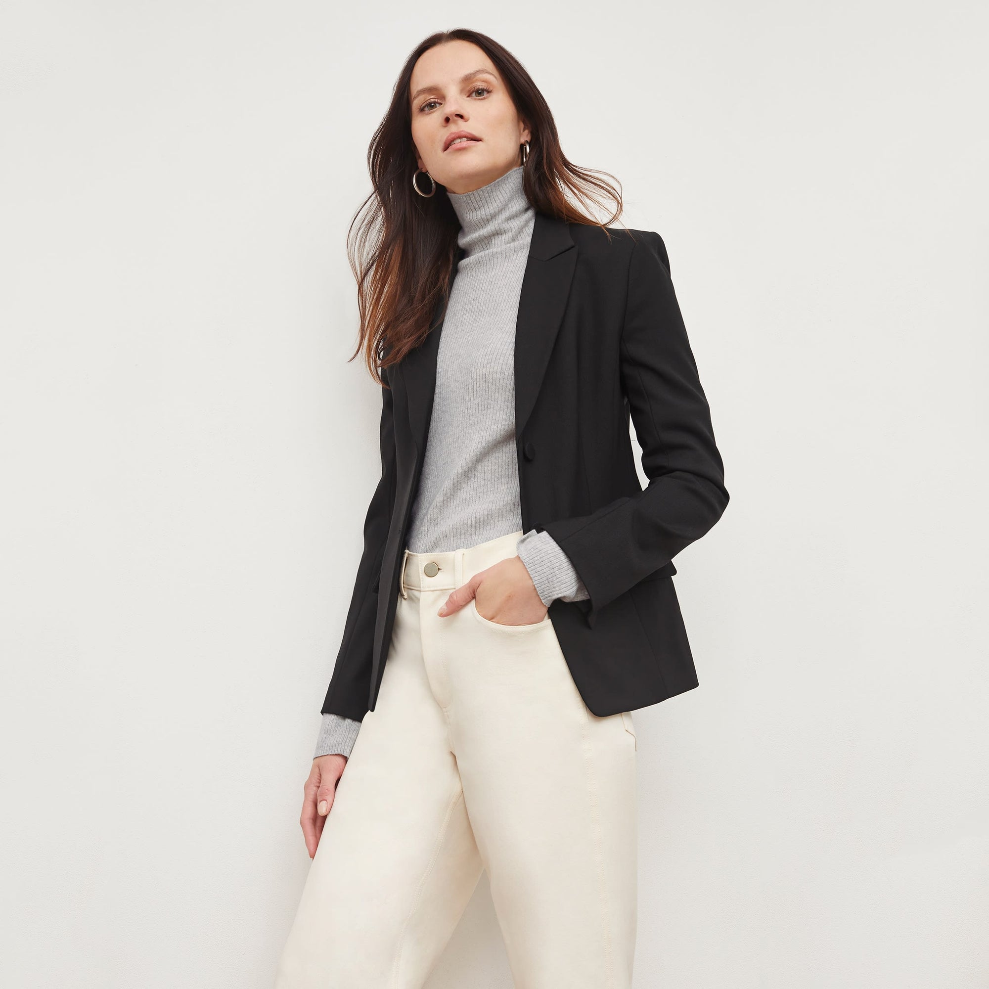 Front image of a woman standing wearing the bennett blazer wool twill in black | Lead