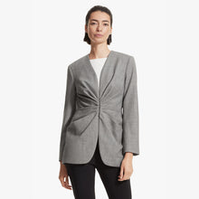 Front image of a woman standing wearing the Carmen jacket sharkskin in Black and white | Lead