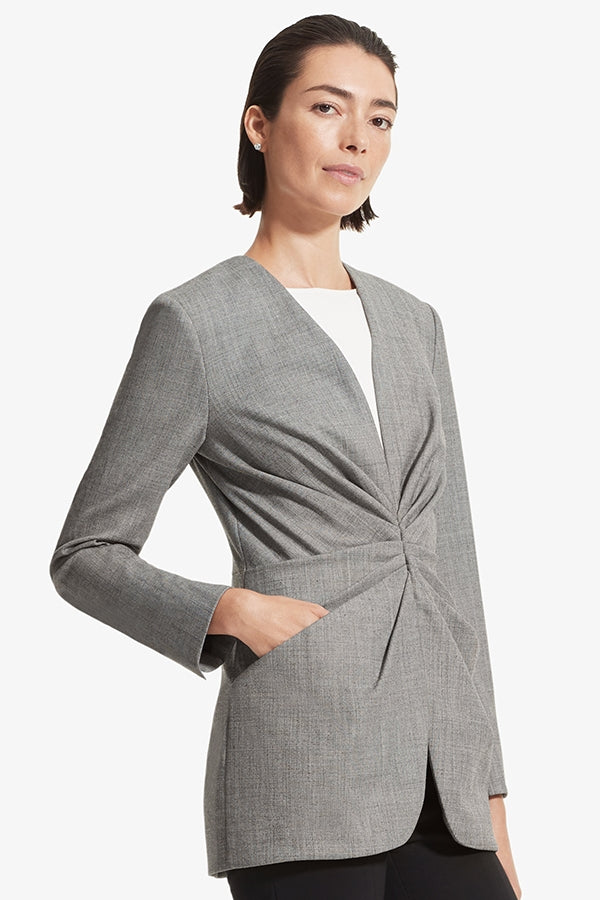 Side image of a woman standing wearing the Carmen jacket sharkskin in Black and white | Grid Hover | Exclude