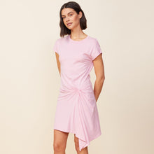 Side view of model wearing the tucked front tee shirt dress in bubblegum.