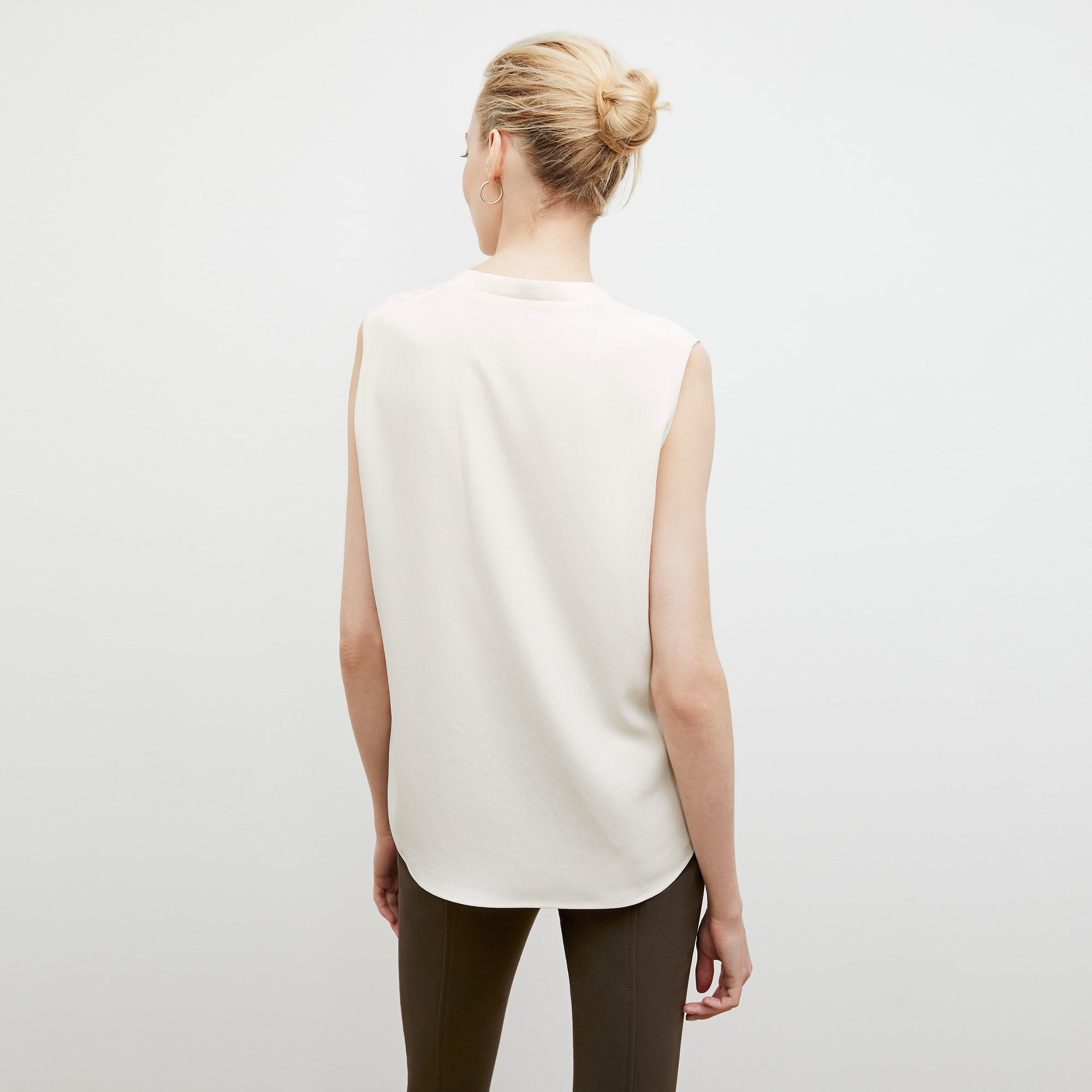 Back image of a woman wearing the Emmy Top in Alabaster