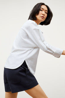Image of a woman wearing the Chiara Top in Blue / Ivory | Exclude