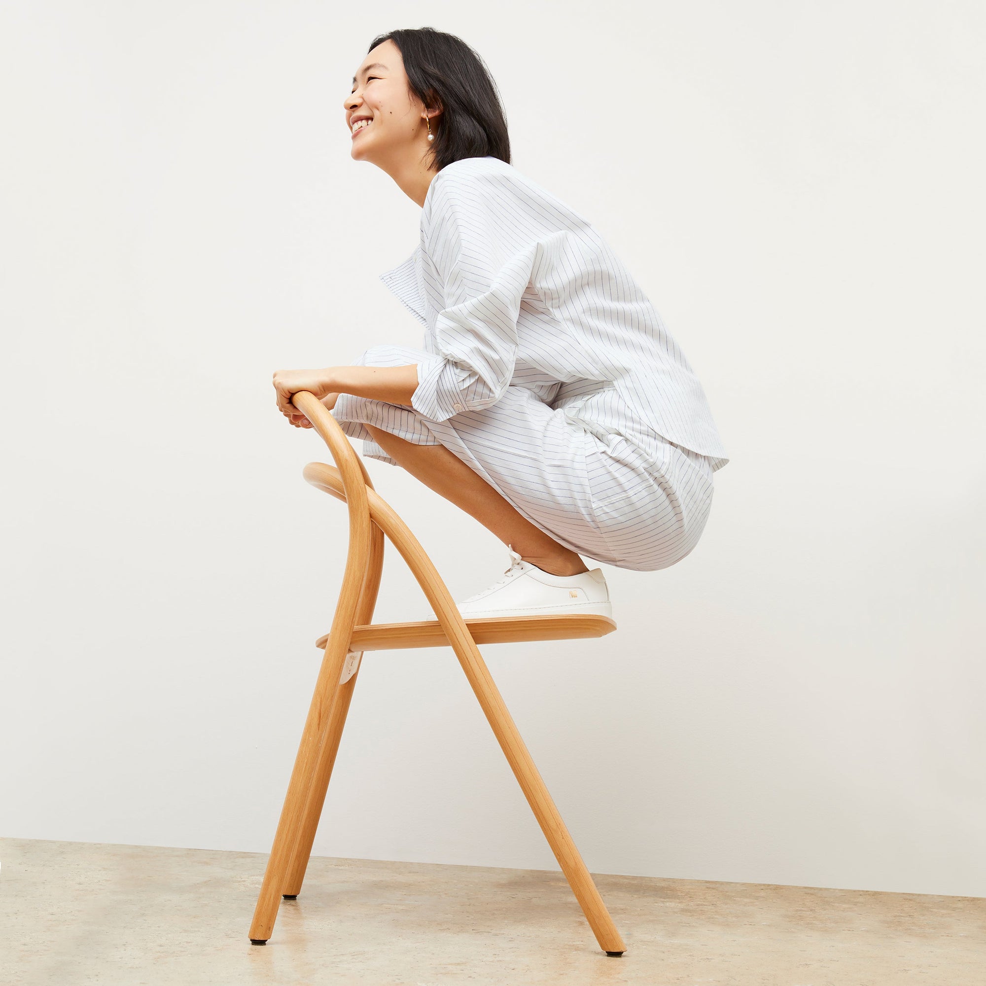 Image of a woman wearing the Chiara Top in Blue / Ivory | Exclude