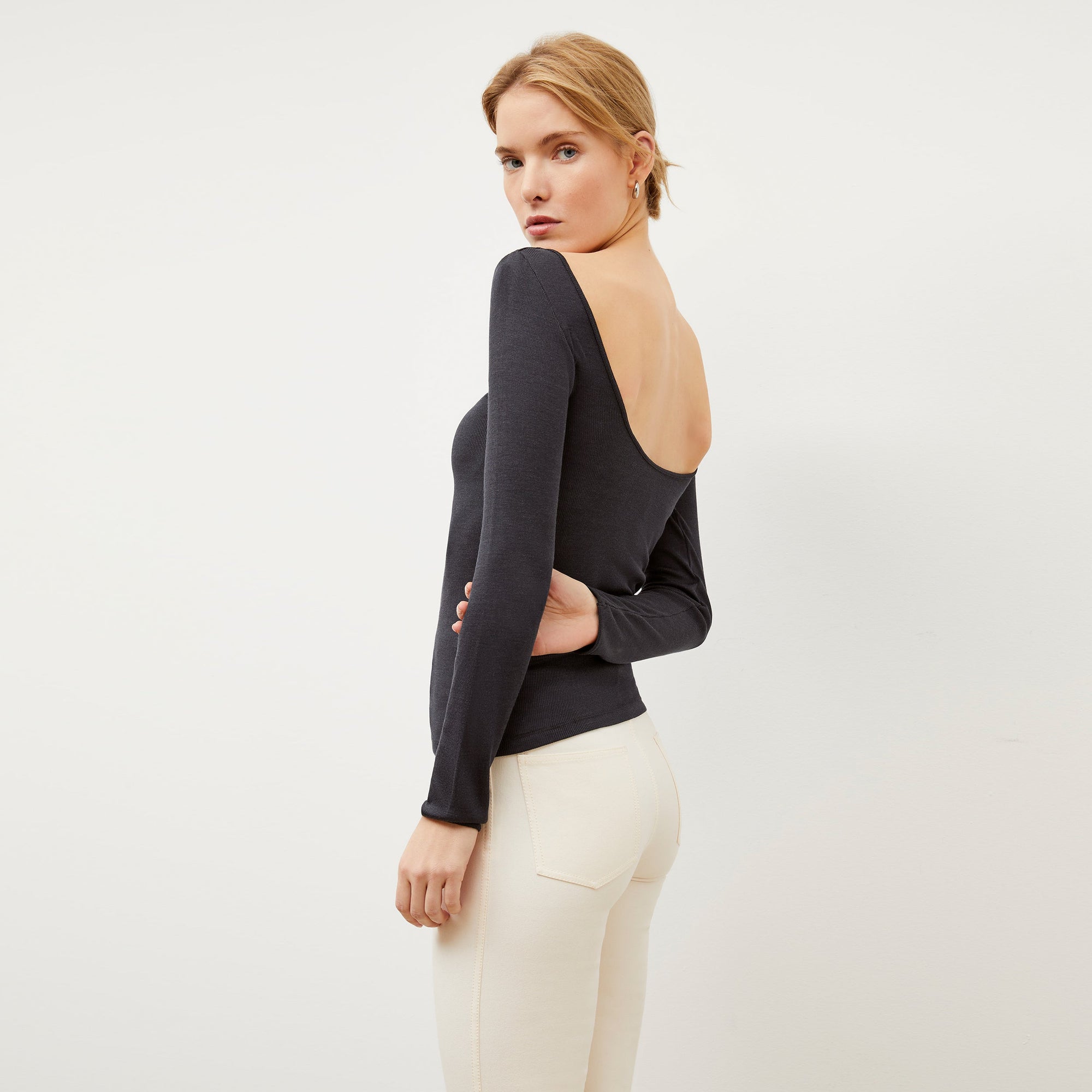 Back image of a woman wearing the Meg Top in Cool Onyx