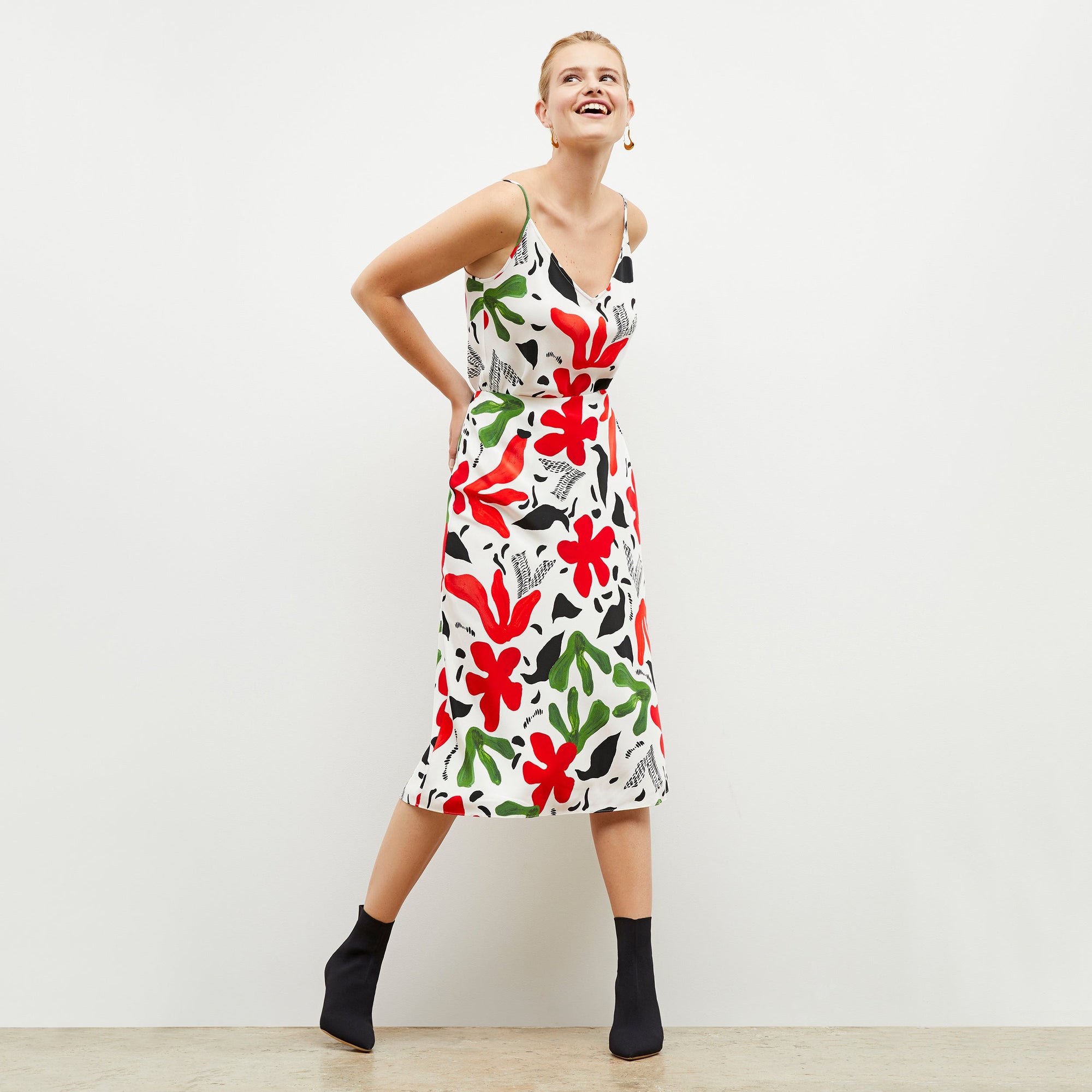 Front image of a woman wearing the lisey top in cutout print