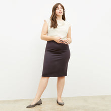 Front image of a woman standing wearing the Cobble Hill Skirt in Haze