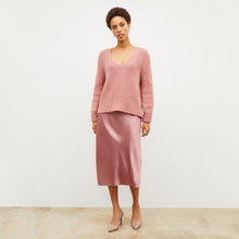 Front image of a woman wearing the orchard skirt in vintage rose
