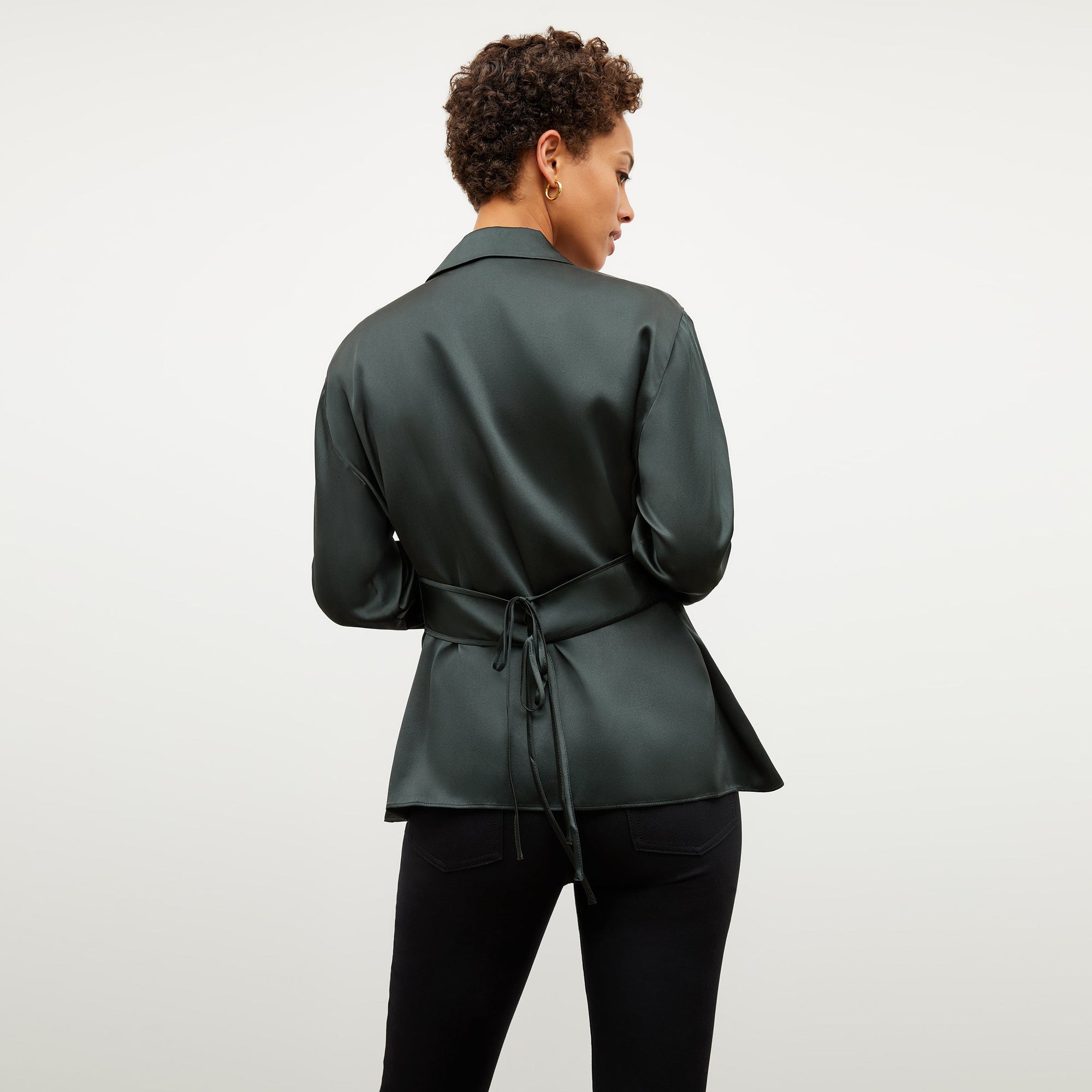 Image of a woman wearing the Alyssa Jacket in Hunter