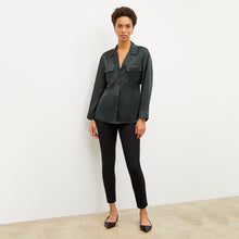Image of a woman wearing the Alyssa Jacket in Hunter