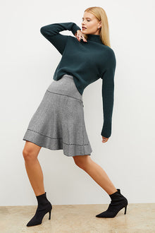 Front image of a woman wearing the luca skirt in black / silver sparkle | Exclude | Grid Hover
