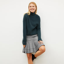 Front image of a woman wearing the luca skirt in black / silver sparkle | Lead