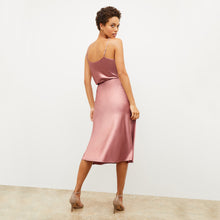Back image of a woman wearing the orchard skirt in vintage rose