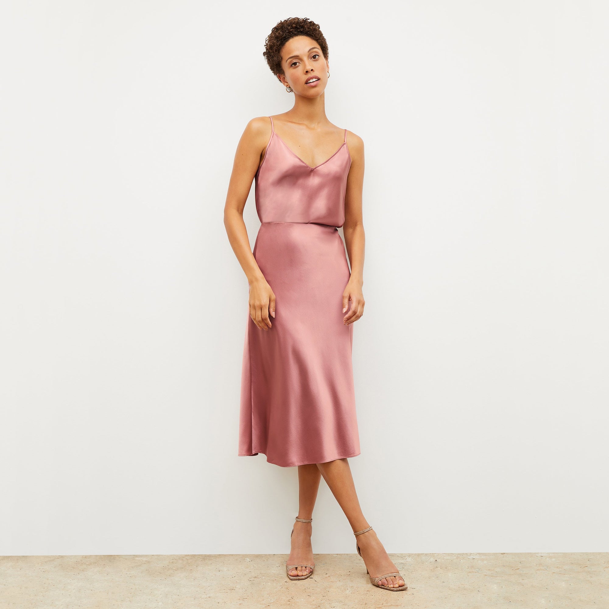 Front image of a woman wearing the orchard skirt in vintage rose | Lead